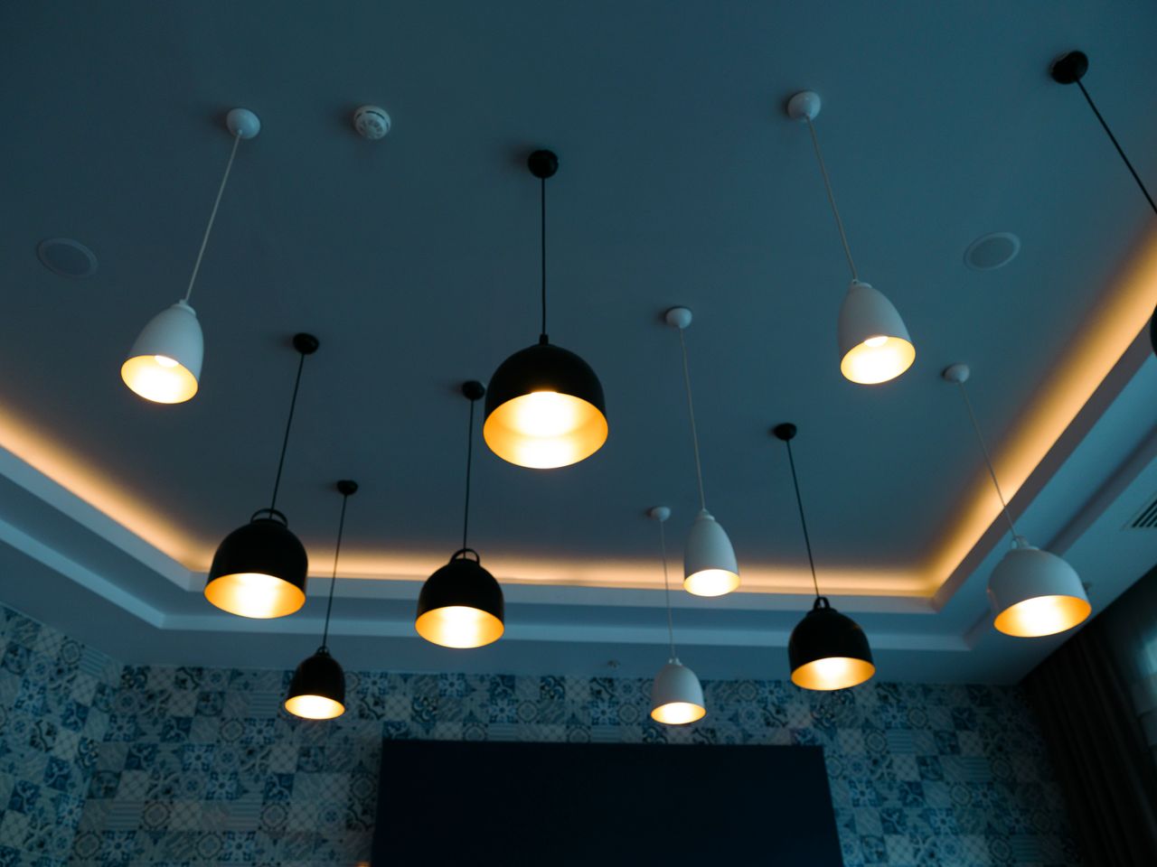 The Art of Drawing Readers In: Your attractive post title goes here Stylish pendant lamps illuminate a modern interior with a chic, contemporary design.